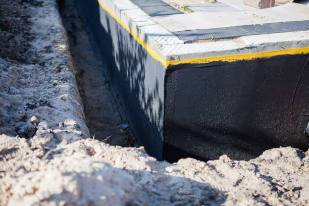 Professional Basement Waterproofing technician working in Etna, OH